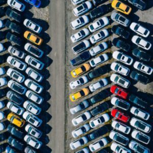 Specialized Hanamark truck loading auction vehicle for delivery.