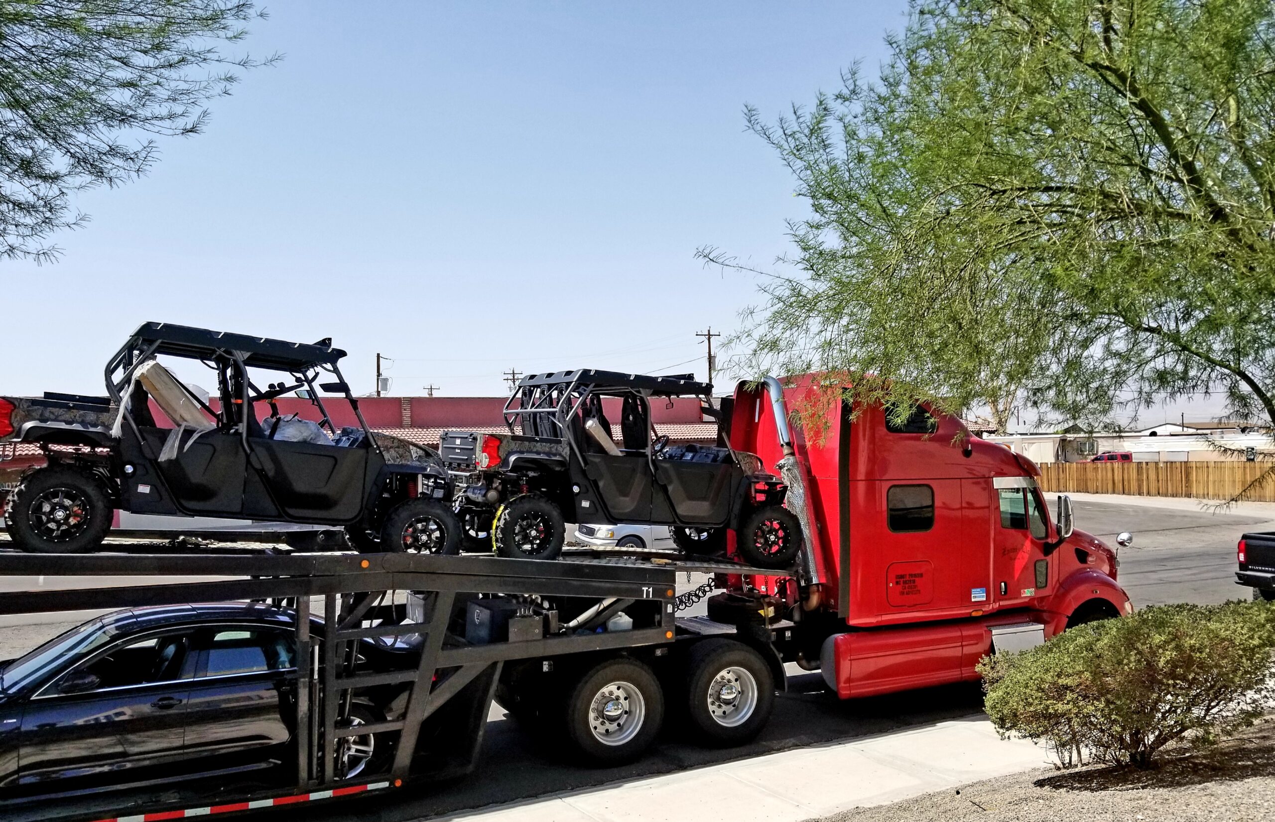 Specialized Hanamark truck loading auction car for delivery.
